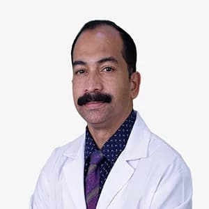Dr Shiby John