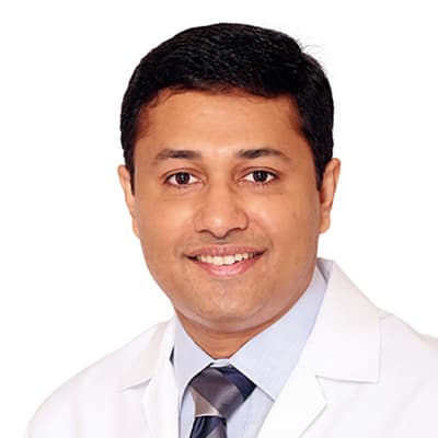Dr. George John